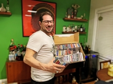 Tristan Iofola at home in Toronto with a box of jungle tapes